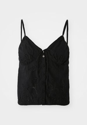 Zwarte top met dunne bandjes, voorzien van een striksluiting aan de voorkant, knoopdetail en ingewikkelde geborduurde patronen op de stof.