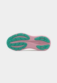 Shoe sole with pink base and teal tread patterns designed for traction and cushioning, marked with "GEL" for shock absorption.