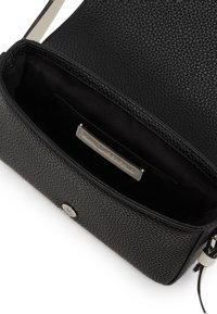 Black leather crossbody bag with textured surface, silver hardware, and an interior pocket. Features a synthetic strap and logo tag.