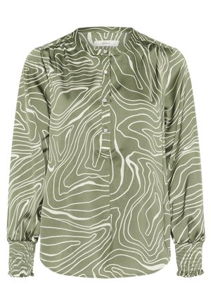 Žalia ilgo rankovė blouse iš švelnios medžiagos, su baltais bangomis ir mygtukais priekyje. Susiraukšlėjusios rankovės su elastinėmis detalėmis.