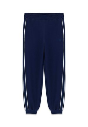 Granatowe spodnie dresowe z białymi paskami po bokach, elastyczną talią i ściągaczami przy kostkach, ułożone płasko na białym tle.