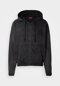 Schwarze Kapuzenjacke mit Reißverschluss, verstellbarer Kapuze, frontalen Taschen, elastischen Bündchen und Saum sowie gesticktem "HUGO"-Logodetail.