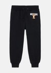 ADDITION UNISEX - Pantaloni sportivi - nero/black
