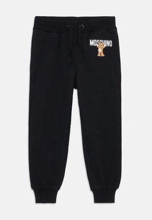 Čierne tepláky vyrobené z mäkkého materiálu, s elastickým pásom na šnúrky, ribbovanými manžetami a grafickým motívom medveďa s textom "Moschino".