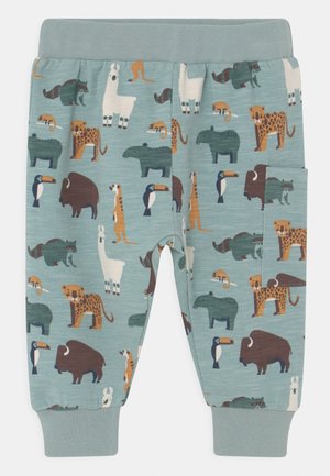 Pantalon bleu clair pour enfants avec poignets élastiques, avec des imprimés d’animaux colorés incluant lama, toucan, bison, guépard, raton laveur et tapir.