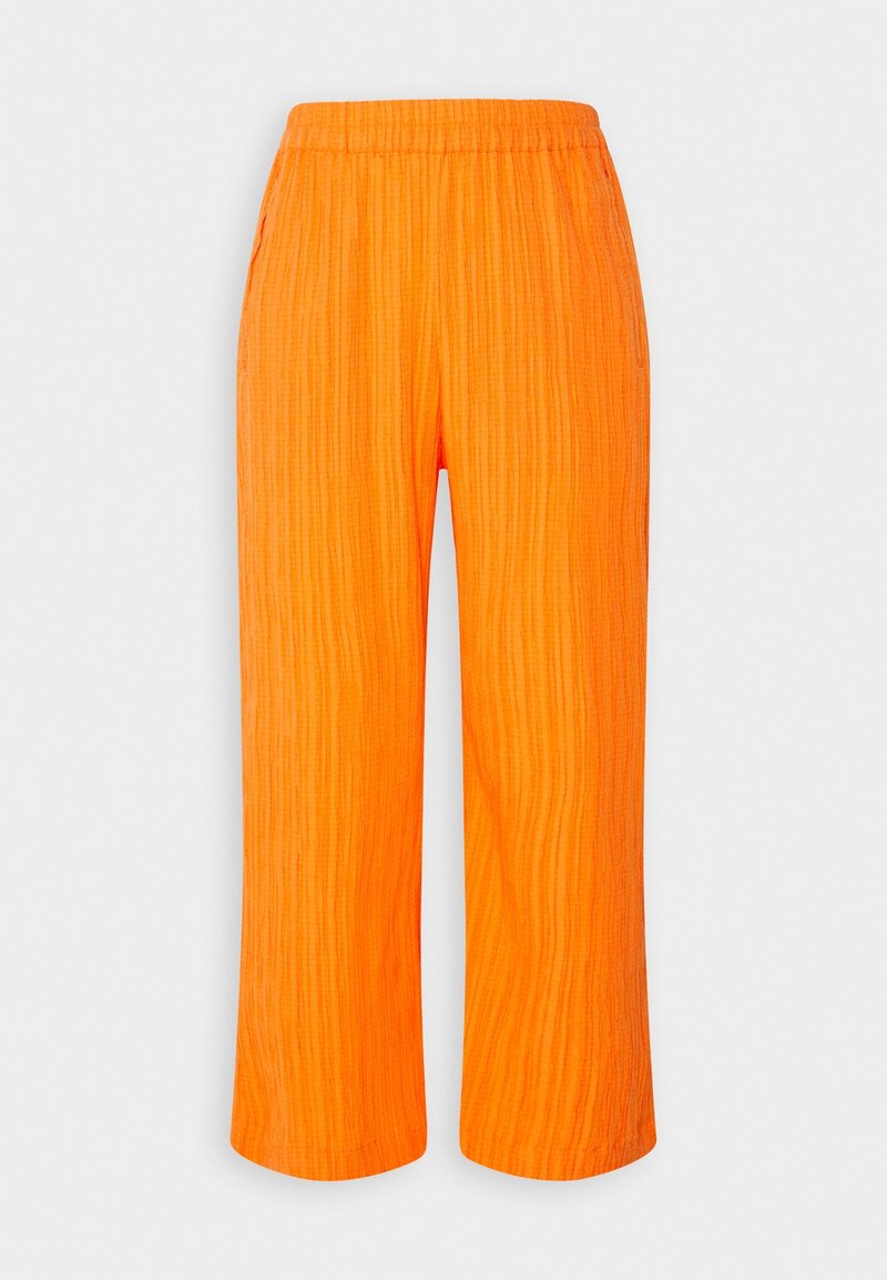 Pantalon ample orange vif avec un motif texturé vertical subtil et une taille élastique, présenté sur un fond blanc.