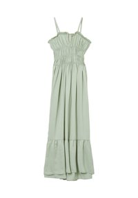 Robe longue vert clair en tissu doux. Comprend des bretelles ajustables, un corsage froncé et un ourlet à volants pour plus de fluidité et de mouvement.