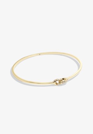 Gold metal bangle with a smooth, round shape and a clasp featuring small clear gemstones along one side. Lightweight and minimalist design.