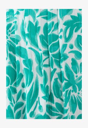 Tessuto floreale con grandi foglie astratte color teal e motivi circolari su uno sfondo bianco, con una consistenza visibile e un design plissettato.