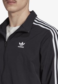adidas Originals LOCK UP - Tréning dzseki - black