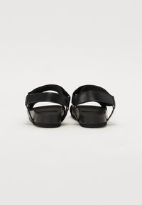 Love Moschino Kotníkové sandály  - black
