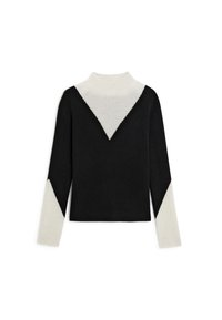 Zwart en crèmekleurig color-blocked sweater met een hoge hals, lange mouwen en een chevronpatroon op de voorkant en mouwen. Zachte textuur.
