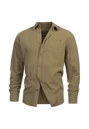 Olijfgroene blouse met lange mouwen, knoopsluiting, een textuurpatroon, een borstzak en bruine knopen. Materialen bieden een lichte rek.