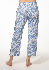 Broek met bloemenpatroon in blauw en crème. Gemaakt van lichte stof, rechte snit, met zijzakken en een comfortabele tailleband.