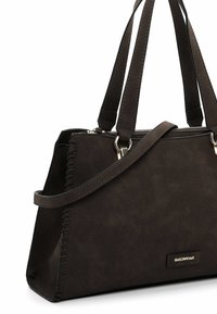 Brown faux leather handbag with stitching detail, dual shoulder straps, and a zippered top closure. Features a subtle brand logo accent.
