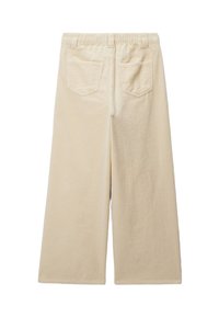 Pantalons en velours côtelé beige à jambes larges avec une finition texturée et une taille élastique. Comprend deux poches arrière et une coupe ample et décontractée.