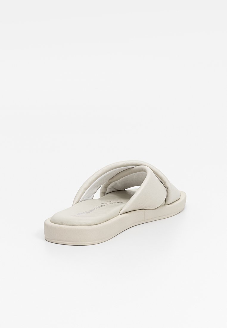 Hellbeige Rutschsandale mit gepolsterten Riemen, einer glatten Oberfläche und einer dicken, strukturierten Sohle für Komfort und Unterstützung.