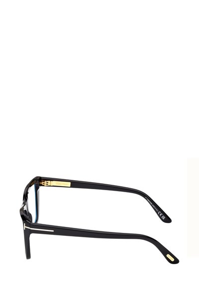 Occhiali da vista neri con lenti rettangolari, finitura lucida, dettagli dorati sulle aste e design elegante. Le aste sono leggermente curve.