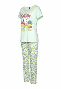 Hellgrünes Schlafanzugset mit einem kurzärmeligen T-Shirt mit Cartoon-Grafiken und gelben Akzenten, kombiniert mit weißen Hosen, die mit gelben Zitronen und grünen Blättern gemustert sind.