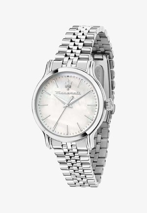 Montre-bracelet en métal argenté avec un cadran rond doté d'un verre en nacre, des marqueurs d'heure en argent et un bracelet à maillons.