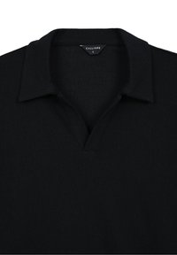 Haut noir à manches longues en maille avec col et ouverture en V, taille large de Calliope, présenté à plat sur fond blanc.