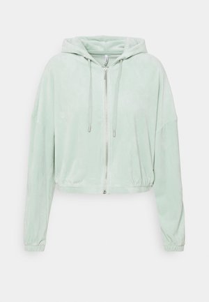 Lys mintgrøn lynlåshættetrøje med snore, lange ærmer, elastiske manchetter og et let croppet, løstsiddende design.