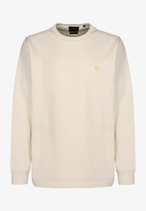 Light beige sweatshirt with a round neckline and long sleeves. Features a small yellow logo on the chest. Smooth fabric texture.