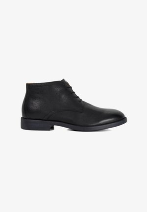 Black leather ankle boots with a smooth texture, round toe, and four eyelets for laces; low heel and subtle stitching detail.
