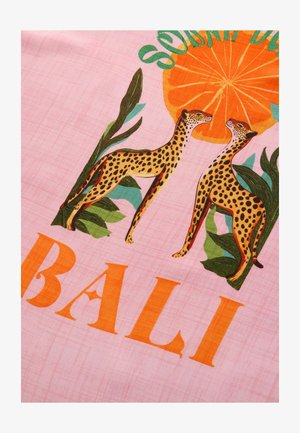 Pink fabric featuring two stylized leopards and green foliage; orange circular pattern above with the text "SOLIDARITY BALI" in orange letters.