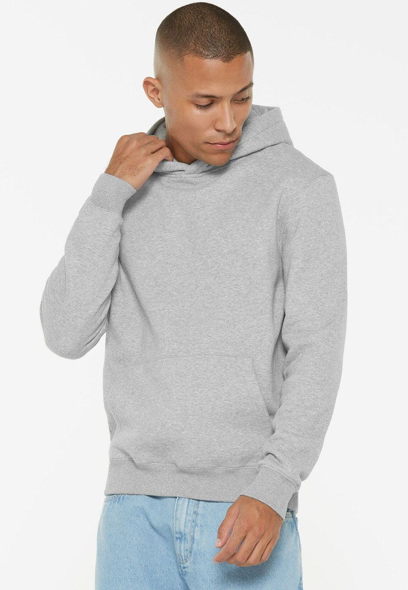 Gray hoodie made of soft material, featuring a front pocket, adjustable drawstring hood, and ribbed cuffs with a relaxed fit.