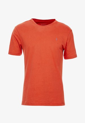 T-shirt à manches courtes à col rond couleur orange brûlé avec petit logo brodé sur la poitrine gauche, design uni, tissu en coton.