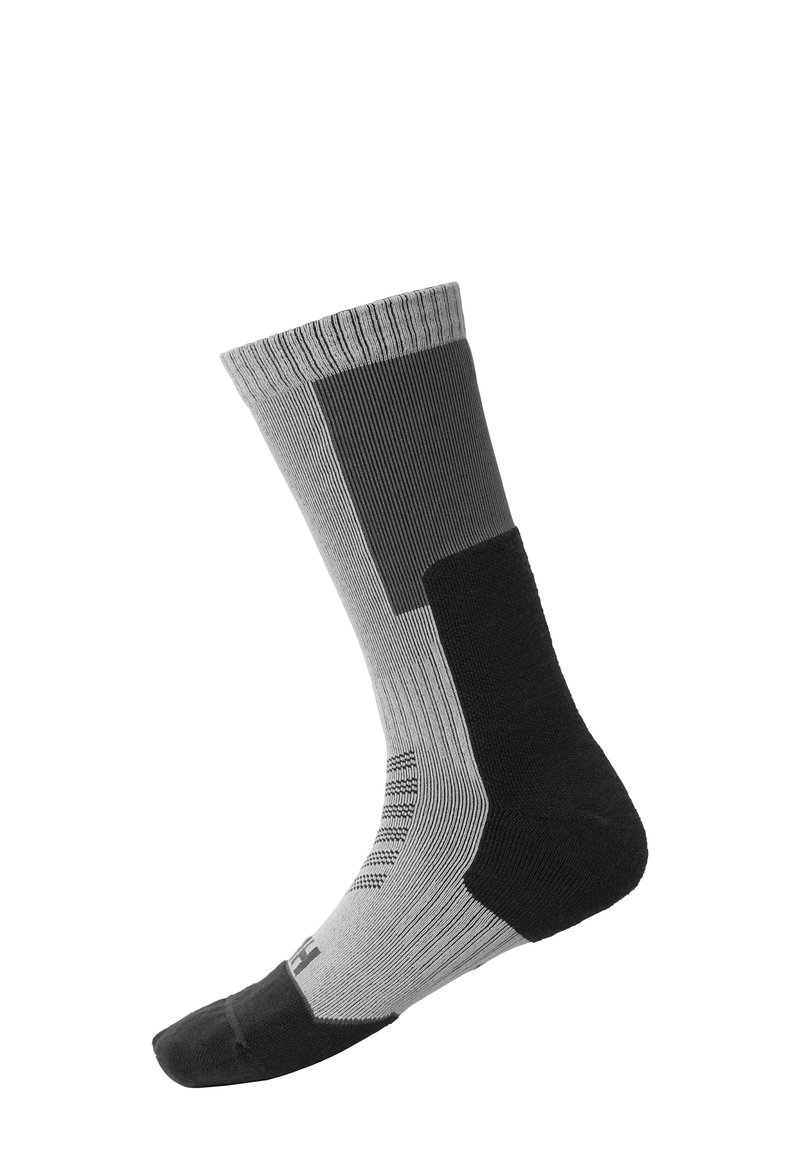 Calcetín negro y gris con textura acanalada. Presenta diferentes tonos, zonas de malla y puntera y talón reforzados. Longitud a media pantorrilla.