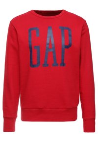 Rode trui van katoen met lange mouwen, geribde halslijn en zoom, met een groot marineblauw "GAP"-logo gedrukt op de voorkant.