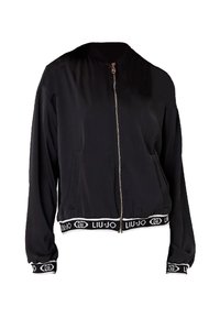 Giacca bomber nera con zip frontale, polsini e vita elasticizzati, caratterizzata da una banda con logo bianco. Tessuto liscio, design cropped e tasche.