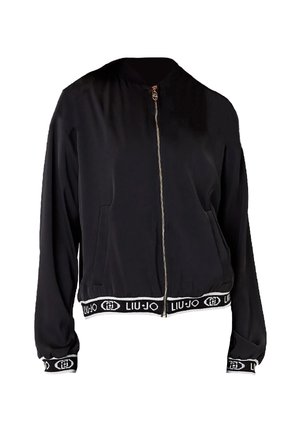 Giacca bomber nera con zip frontale, polsini e vita elasticizzati, caratterizzata da una banda con logo bianco. Tessuto liscio, design cropped e tasche.