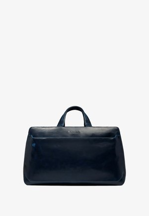 Marineblauwe leren tas met een glanzende afwerking, verkopend een rechthoekige vorm, dubbele handvaten en een voorvak met contrasterende blauwe stiksels.