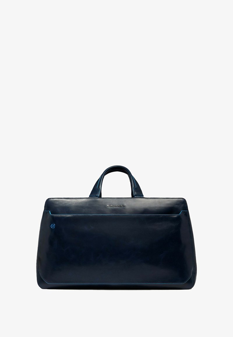 Marineblaue Ledertasche mit glänzendem Finish, rechteckiger Form, zwei Griffen und einer Fronttasche mit kontrastierenden blauen Nähten.