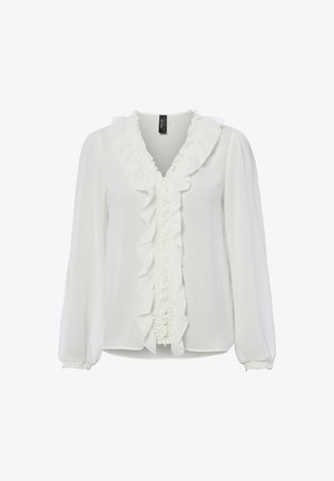 Blouse blanche à manches longues avec col en V à volants et détails de volants sur le devant, poignets élastiques et coupe légèrement ample.