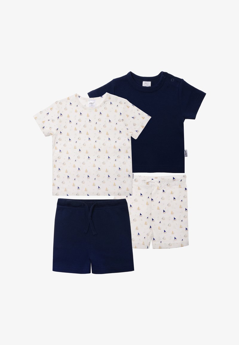 Two sets of children's clothing: a white shirt with sailboat pattern, navy blue shirt, navy blue shorts, and white shorts with a matching pattern.
