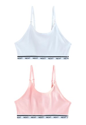 Białe i różowe miękkie biustonosze z regulowanymi ramiączkami i elastycznymi paskami z napisem "NEXT" u dołu.