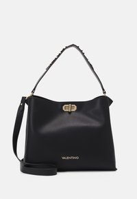 Black leather handbag with a structured shape, gold hardware, and a decorative studded strap. Features embossed brand name at the base.