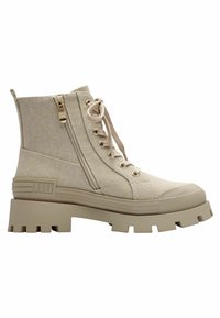 Bottines en toile beige avec une semelle en caoutchouc épaisse, des lacets à l'avant, une fermeture éclair sur le côté et un tissu texturé. Bout rond et accents contrastants.