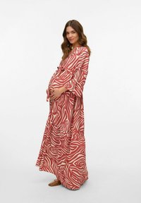Maxi jurk in rood met een crèmekleurig abstract patroon, met een tailleband, wijde mouwen en vloeiende stof. Nette textuur en relaxte pasvorm.