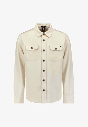 Cream-colored long-sleeve shirt with a button-up front, two chest pockets, and black buttons. Made of durable fabric with a smooth texture.