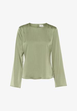 Haut à manches longues en satin de couleur vert olive clair avec un col rond, des plis subtils aux épaules et une fermeture éclair à l'arrière. Fini au toucher lisse.