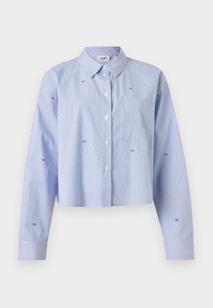 Light blue cropped button-up shirt with subtle vertical stripes, long sleeves, chest pocket, and small embroidered logo details.