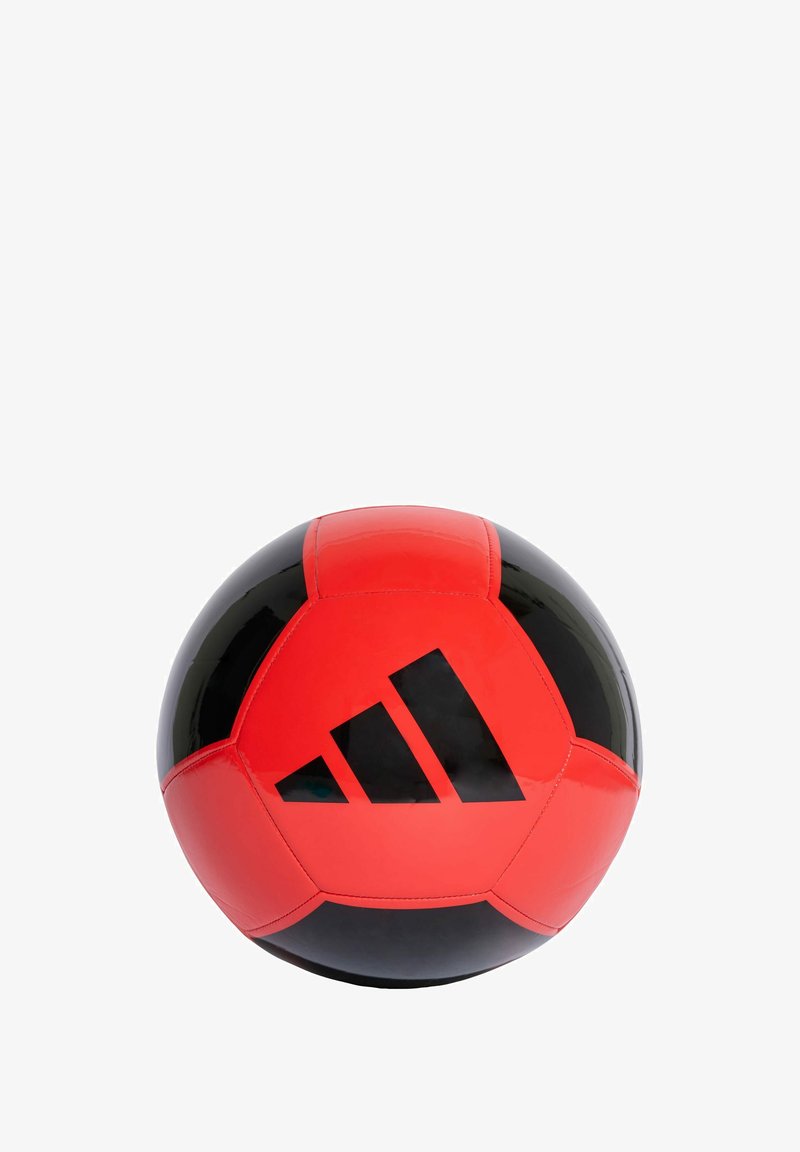 Red and black soccer ball made of synthetic material, featuring black detailing and an Adidas logo on one side. Smooth, glossy finish.
