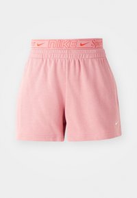 Růžové sportovní kraťasy s elastickým pasem, na kterém je nápis "Nike" v oranžové barvě. Vyrobené z měkké tkaniny se jednoduchým, čistým designem a bez kapes.