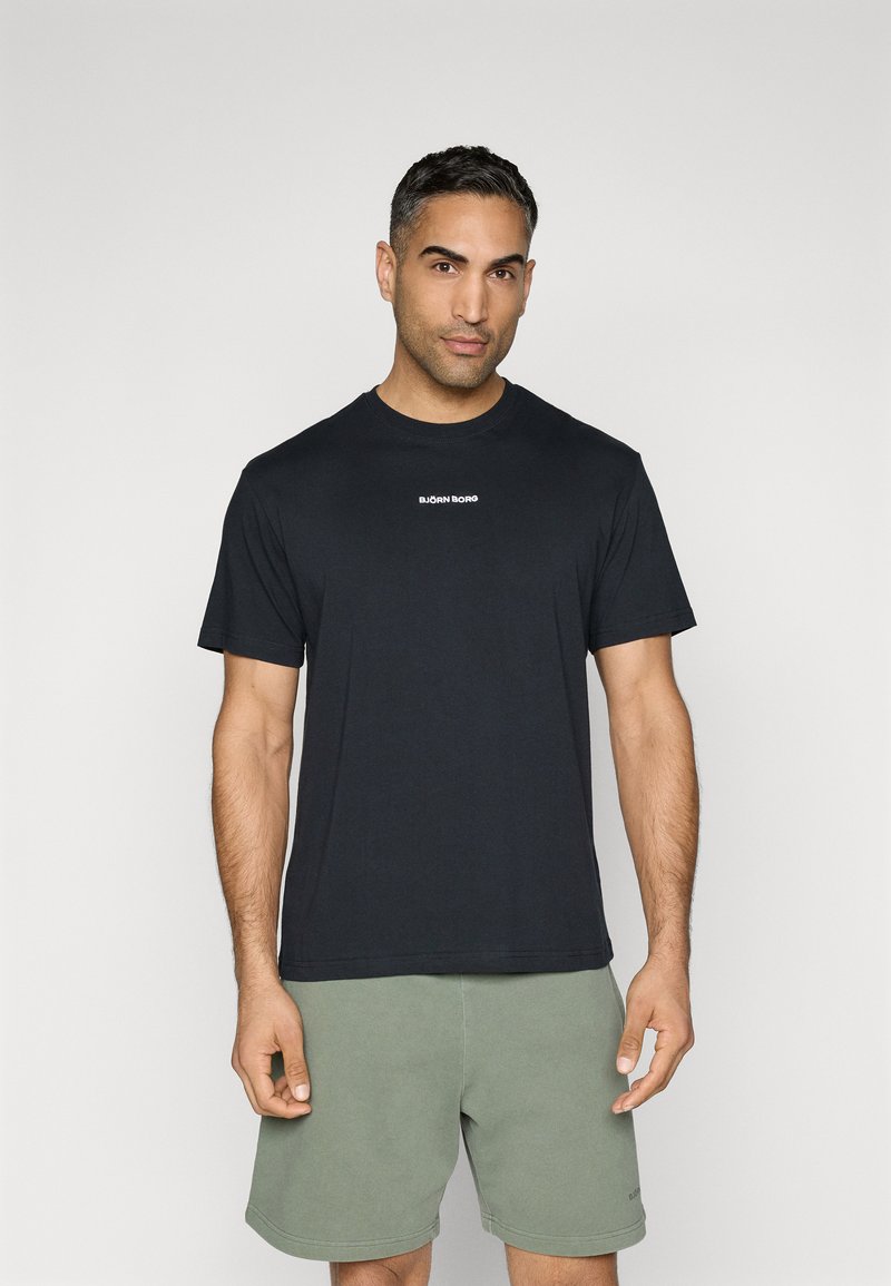 Black cotton t-shirt with short sleeves and crew neck, featuring a small white "BJÖRN BORG" logo centered on the chest.