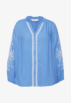 Blouse bleue en tissu léger avec un col en V, un col à volants et une broderie florale sur les manches, avec des boutons sur le devant.